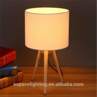 Modern wood tripod base table lamp with edison bulbs